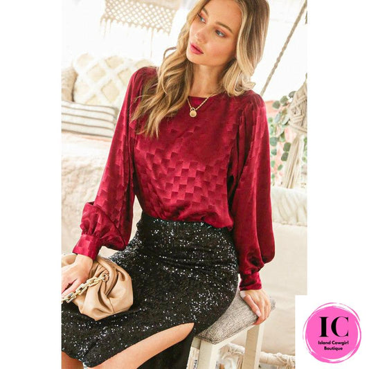 Women's burgundy blouse.